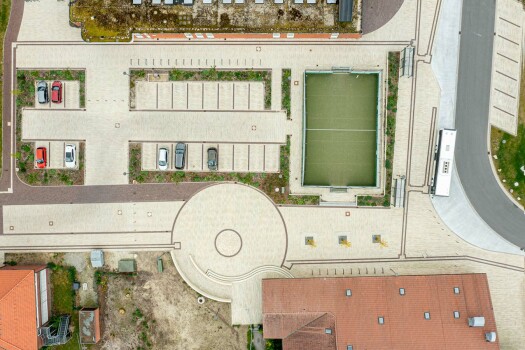Garrel (D), School and sports center, Umbriano Granite beige, textured.