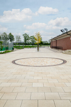 Garrel (D), School and sports center, Umbriano Granite beige, textured.