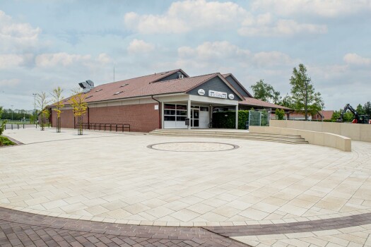 Garrel (D), School and sports center, Umbriano Granite beige, textured.