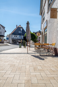 Waldeck (D), City centre, Umbriano Granite beige, textured.